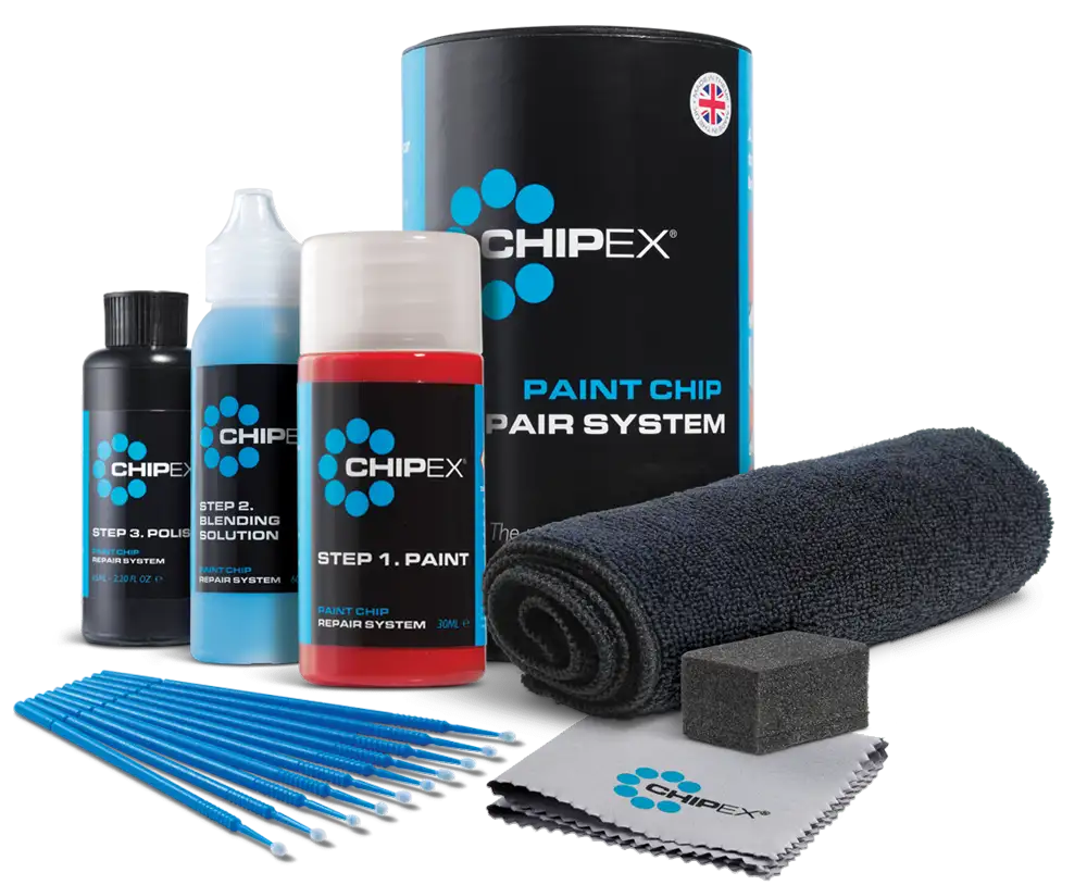 An image of the Chipex paints and other items that you get in the available kits. Paint bottle is a red bottle with a rounded lid. Blending solution is in a blue bottle with a nozzle based lid. Polish is in a white bottle with rounded lid. Extra accessories included in the image are brushes, paint removal cloth, microfiber cloth and a paint removal cloth foam block.